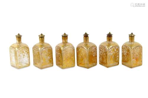 A SET OF SIX FINE MOULD-BLOWN AND GOLD-PAINTED SQUARE GLASS BOTTLES
