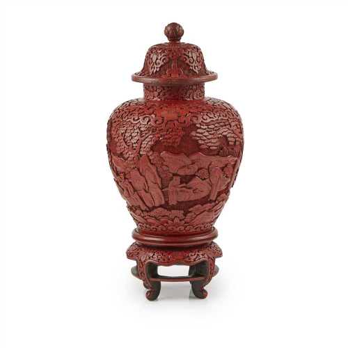 CINNABAR LACQUER VASE AND COVER LATE QING DYNASTY, 19TH CENTURY the baluster body deeply carved with