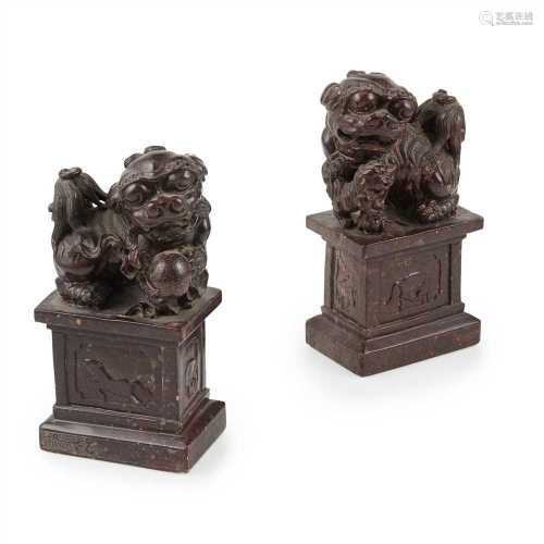 ? PAIR OF SOAPSTONE CARVING 'DOGS OF FO' ON PLINTHS LATE QING DYNASTY-REPUBLIC PERIOD, 19TH-20TH