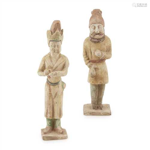 TWO MALE POTTERY FIGURES TANG DYNASTY, 8TH-9TH CENTURY one depicting a foreigner wearing a red
