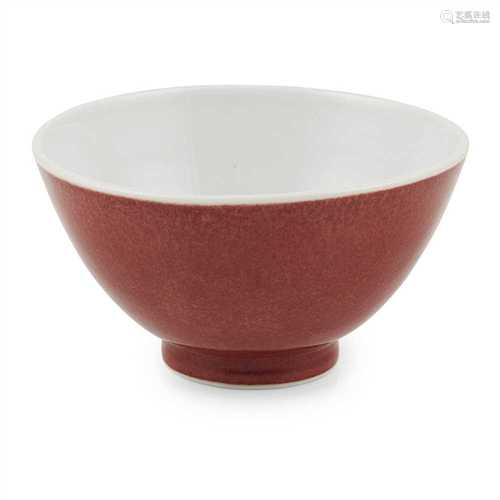 RED GLAZE DEEP BOWL 20TH CENTURY of plain form, the outer body decorated in a slightly mottled red