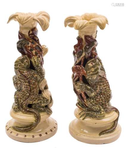 Two Alexander Lauder (Barnstaple) pottery grotesque candlesticks: each modelled with a warty