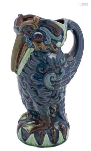 A Longpark (Torquay) grotesque bird jug: modelled standing with beak on chest,