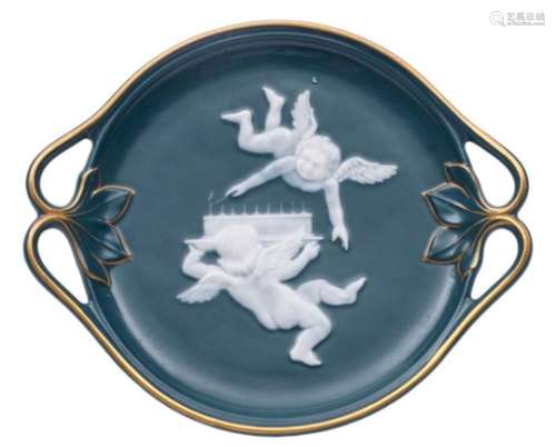 A small pate-sur-pate teal-blue ground dish attributed to Alboin Birks: with foliate branch handles,