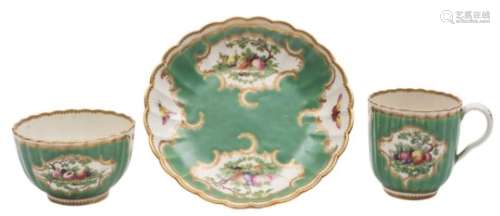 A First Period Worcester trio: of ribbed form decorated with bunches of fruit, foliage,