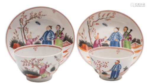 A pair of New Hall famille rose hardpaste teabowls and saucers: each painted with a garden scene
