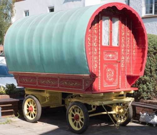 A Bow Top Vardo (gypsy caravan) of traditional design: the arched green canvas roof covering red