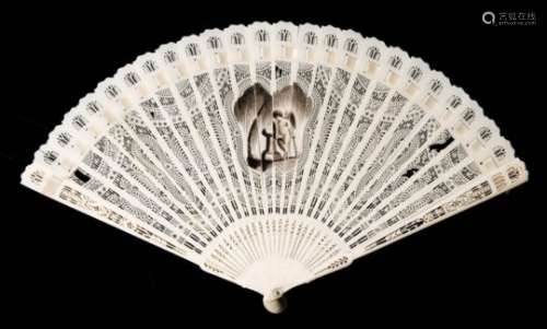 An early 19th century ivory brise mourning fan: the central cartouche decorated with a cherub