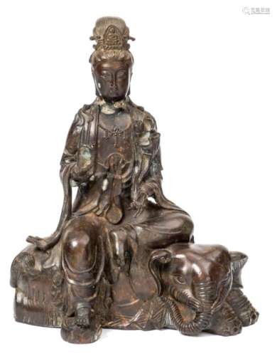 A Chinese bronze figure of Samantabhadra: seated on a recumbent elephant,