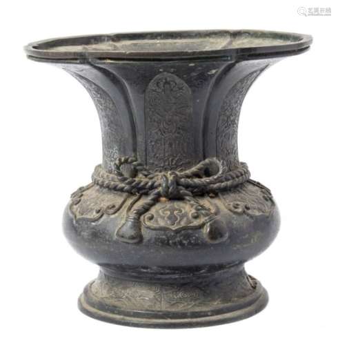 A Chinese bronze vase: of squat baluster form with lobed flared rim,