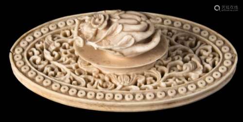 A Canton carved and reticulated ivory sewing accessory: of oval form carved with scrolling peony,