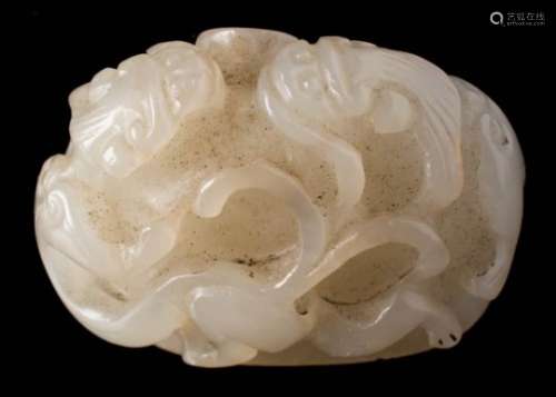 A Chinese jade 'chilong' carving: of domed form carved overall with two opposing chilong,