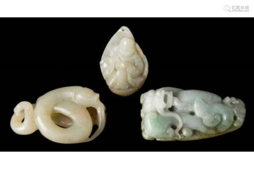 A CHINESE CARVED JADE PENDANT: OF TRIANGULAR OUTLINE WITH A SEATED FIGURE
