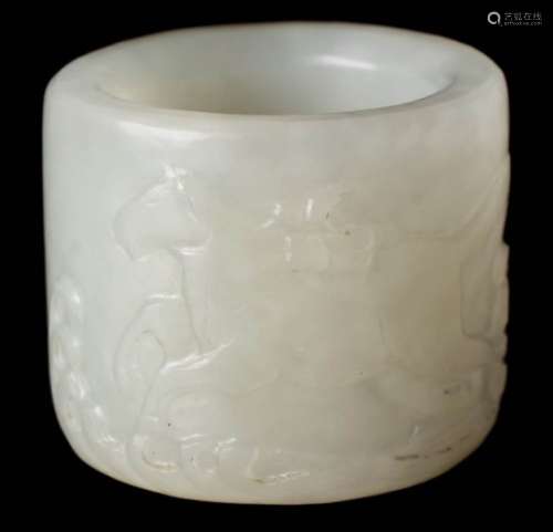 A Chinese jade archer's ring: carved in low relief with a dragon-horse carrying a bundle of scrolls