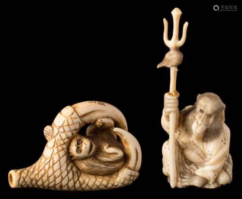 A Japanese carved ivory netsuke: depicting a monkey held within a bird's talons, signed, 4.5cm.