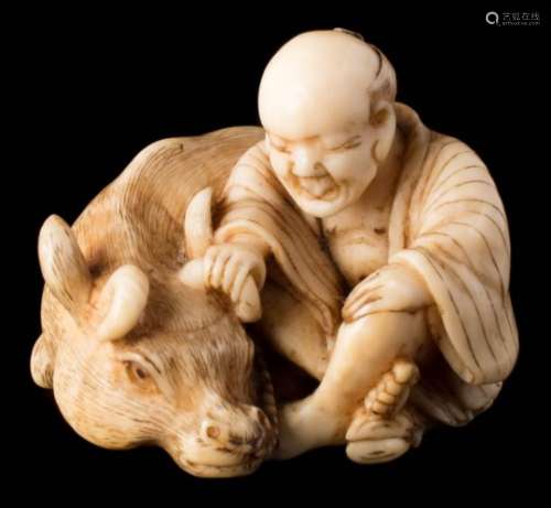 A Japanese carved ivory netsuke: of a farmer seated with his oxen, signed Masayoshi, 3.5cm. wide.