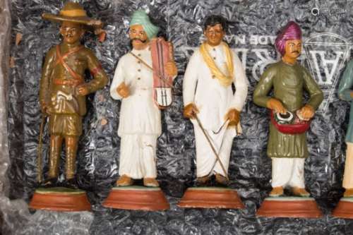 A collection of twenty four Indian Raj plaster and terracotta educational figures: depicting