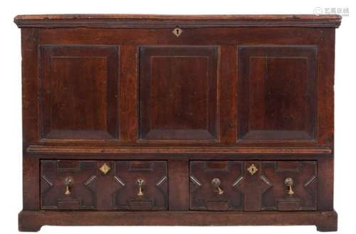 An 18th Century oak rectangular dower chest:, the hinged top with a moulded edge,