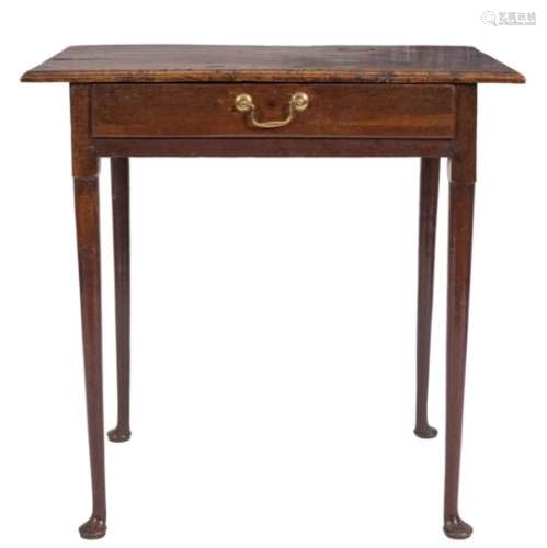 An 18th century oak rectangular side table: with a burr figured overhanging top,