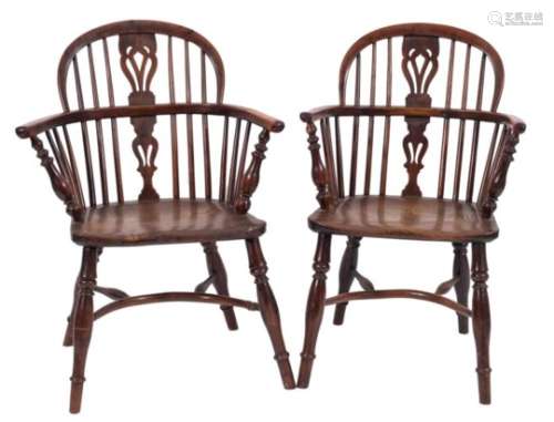Two similar early 19th Century yew-wood and elm stick back Windsor elbow chairs:,