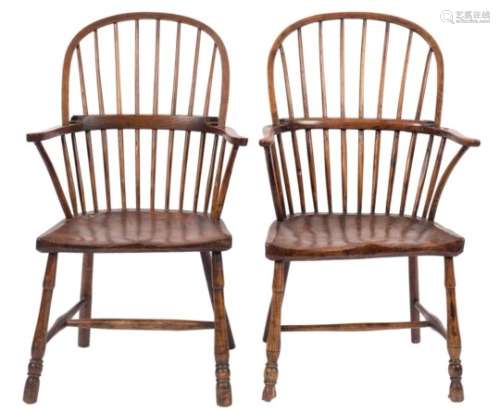 A harlequin set of four 19th Century elm, ash and fruitwood stick back Windsor elbow chairs:,