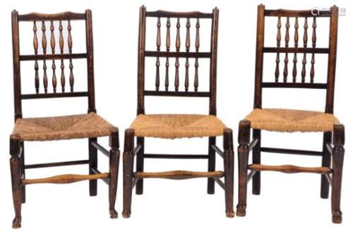 A harlequin set of six early 19th Century ash and fruitwood spindle back dining chairs:,