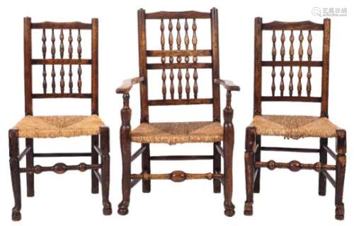 A harlequin set of seven early 19th Century ash and fruitwood spindle back dining chairs:,