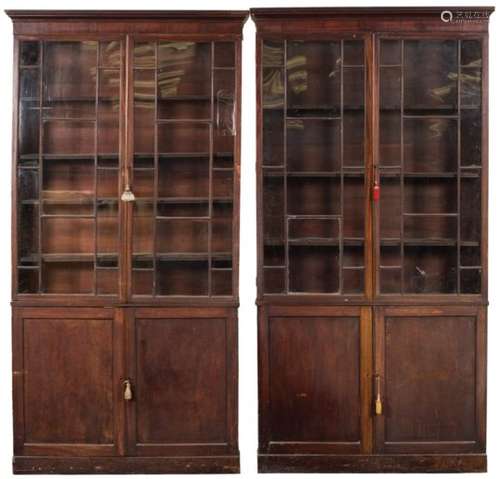 A pair of 19th Century mahogany bookcases:, the upper parts each with a moulded cornice,