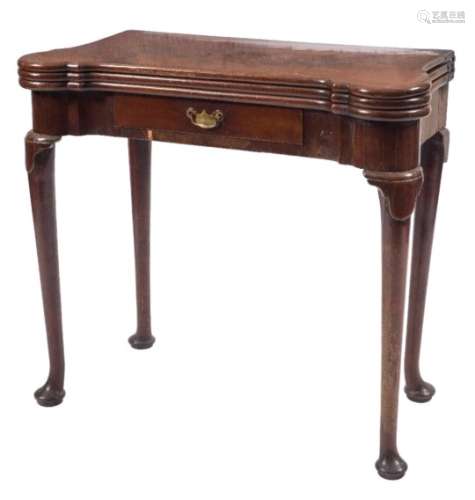 A mid 18th Century mahogany triple top games table:, having projecting rounded corners,