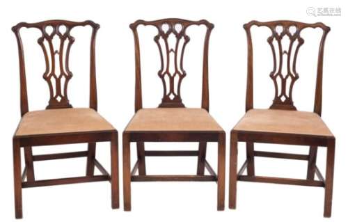A set of six carved mahogany dining chairs in the Chippendale taste:,