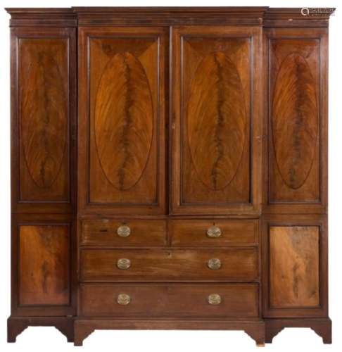 A late 19th century mahogany and inlaid breakfront wardrobe,:bordered with ebony and boxwood lines,
