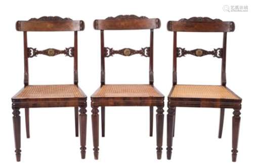 A set of three Regency carved rosewood dining chairs:,
