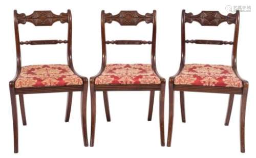 A set of four Regency carved mahogany dining chairs:,