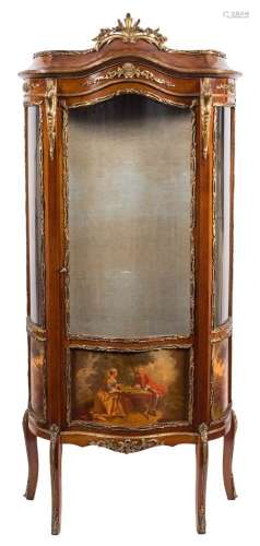 An early 20th Century French vitrine:, with a glazed serpentine door enclosing glass shelves,