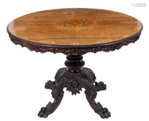 A 19th Century Goanese rosewood, marquetry and carved and ebonised wood circular centre table:,
