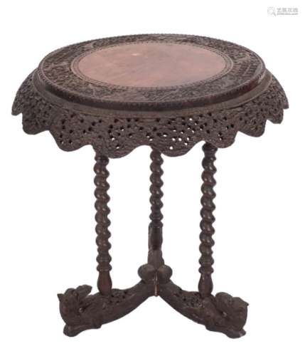 A 19th century Indian carved hardwood circular centre table,
