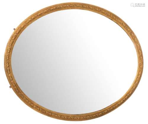 A Victorian giltwood and gesso oval mirror of large size,