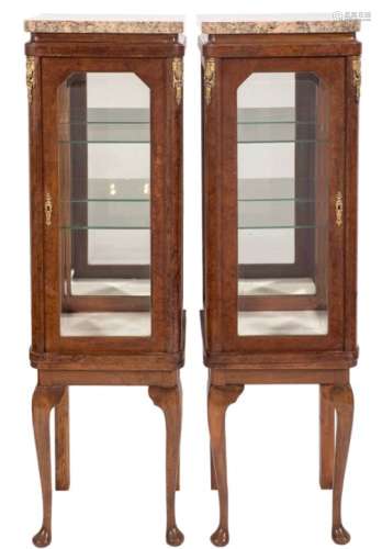 A pair of French amboyna veneered, inlaid and brass mounted square upright display cabinets:,