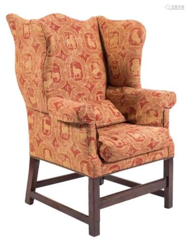 A mahogany wing armchair in the Georgian taste: fully upholstered with maroon covering 120cm high.