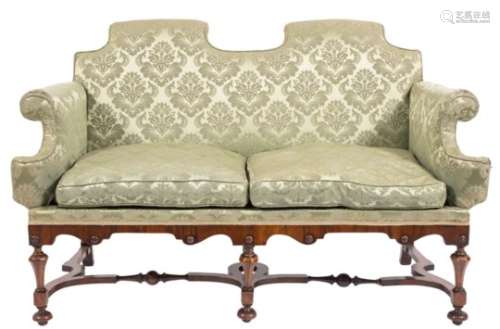 A walnut and crossbanded frame twin seat settee in the William and Mary taste,