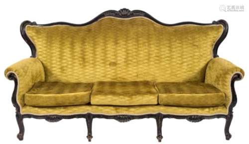 A carved and ebonised three seat settee in the French taste:,