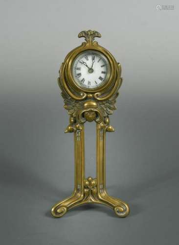 An Art Nouveau brass desk clock by the British United