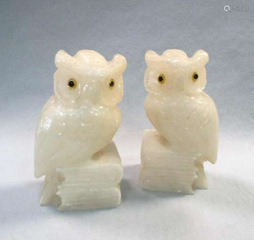 A pair of carved alabaster bookends,
