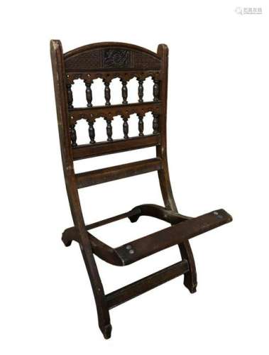 An Aesthetic period folding chair, the design