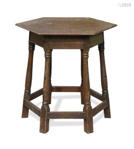 An early 20th century oak centre table in the manner of