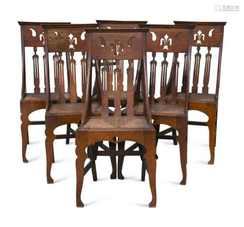 A set of six Arts & Crafts oak dining chairs,