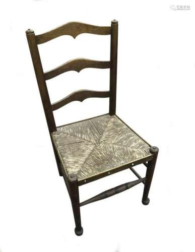 An Arts & Crafts rush seated child's chair,