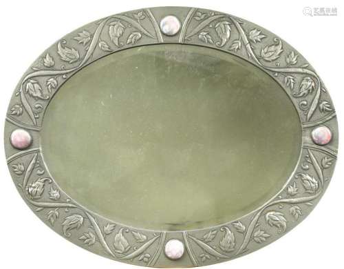 An Arts & Crafts pewter oval bevelled wall mirror,