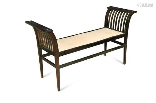 An early 20th century ebonised window seat,