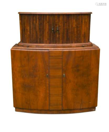An Art Deco bow front walnut cocktail cabinet,